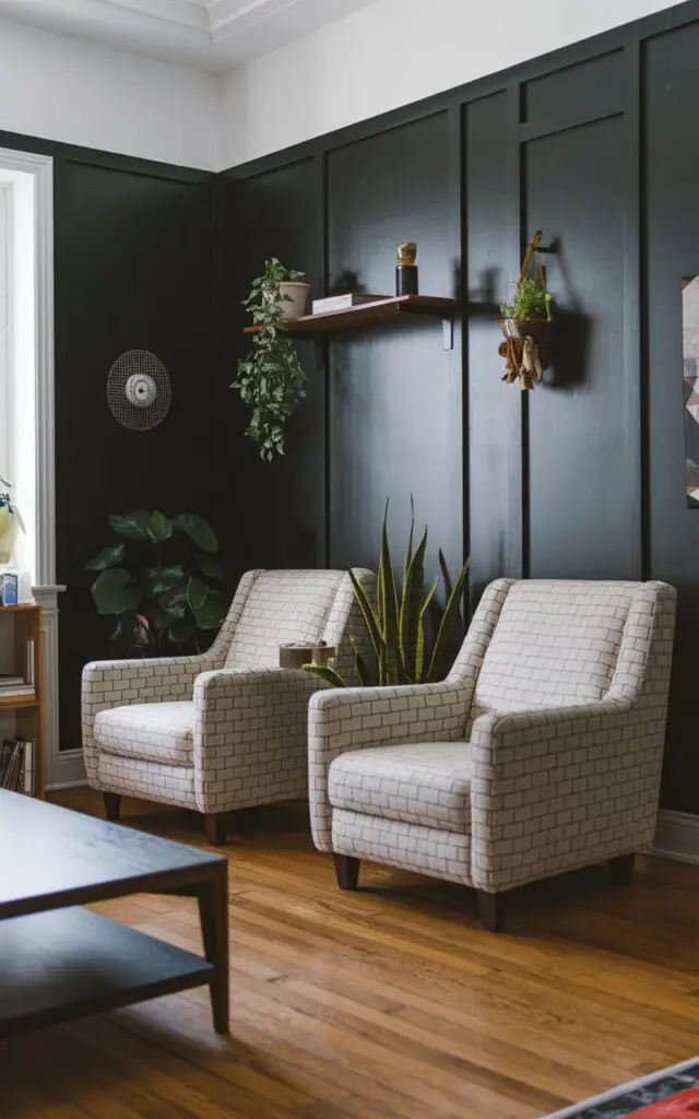 A photo of a modern Bauhaus living room with dark accent walls. There are two statement armchairs with a light colour and a patterned fabric. The room has a few pieces of furniture, including a coffee table and a shelf. The walls have a few hanging items, such as a plant and a decorative object. The floor is made of hardwood. The space is well-lit.