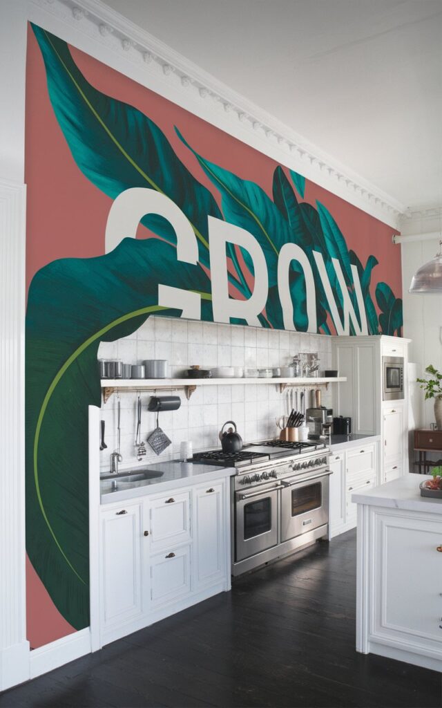 A photo of a modern artistic kitchen with one side of the wall having a graphic bold print wallpaper. The kitchen is fully furnished, spacious, and functional. The wallpaper features a large, green, leafy plant with white text that says "Grow". The plant extends across the wall, with the text appearing to grow out of the plant. Light focuses on the graphic wallpaper.