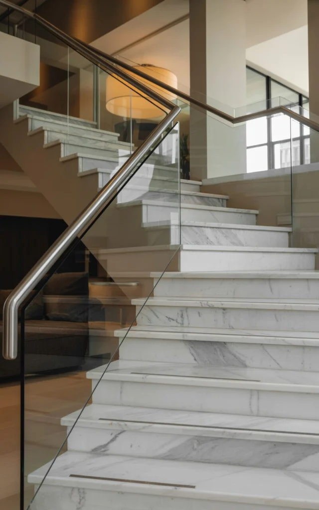 Wrap the staircase in custom stone or marble
