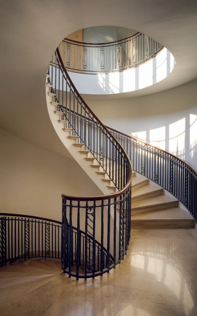 Highlight the curve using statement stair railings