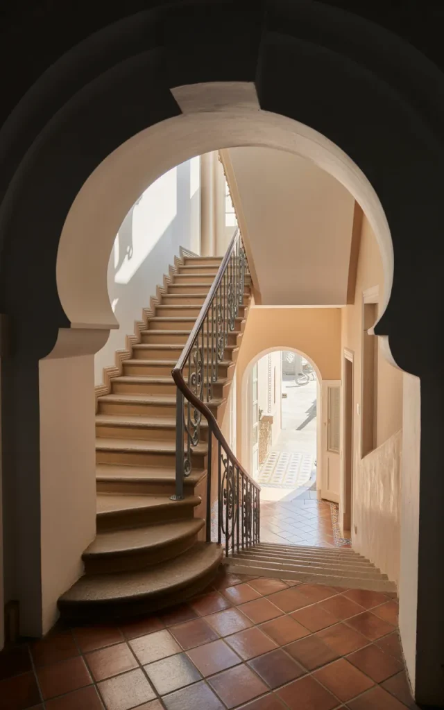 Frame the Staircase With Dark Archways
