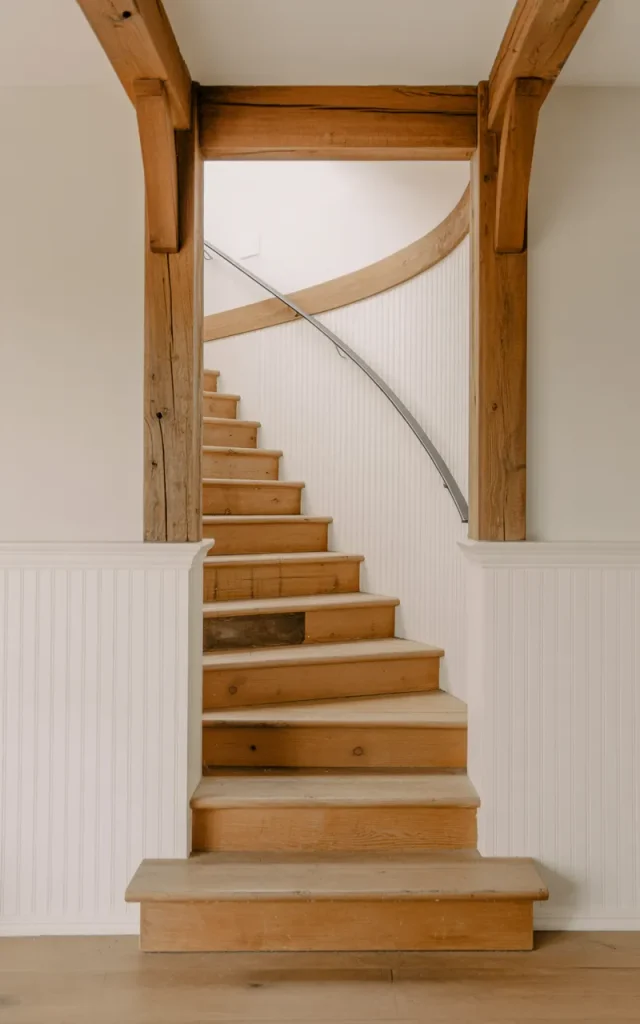 Frame the staircase with exposed wood beams