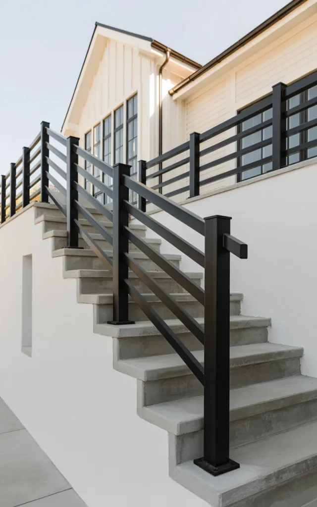Incorporate black metal railings for bold contrast