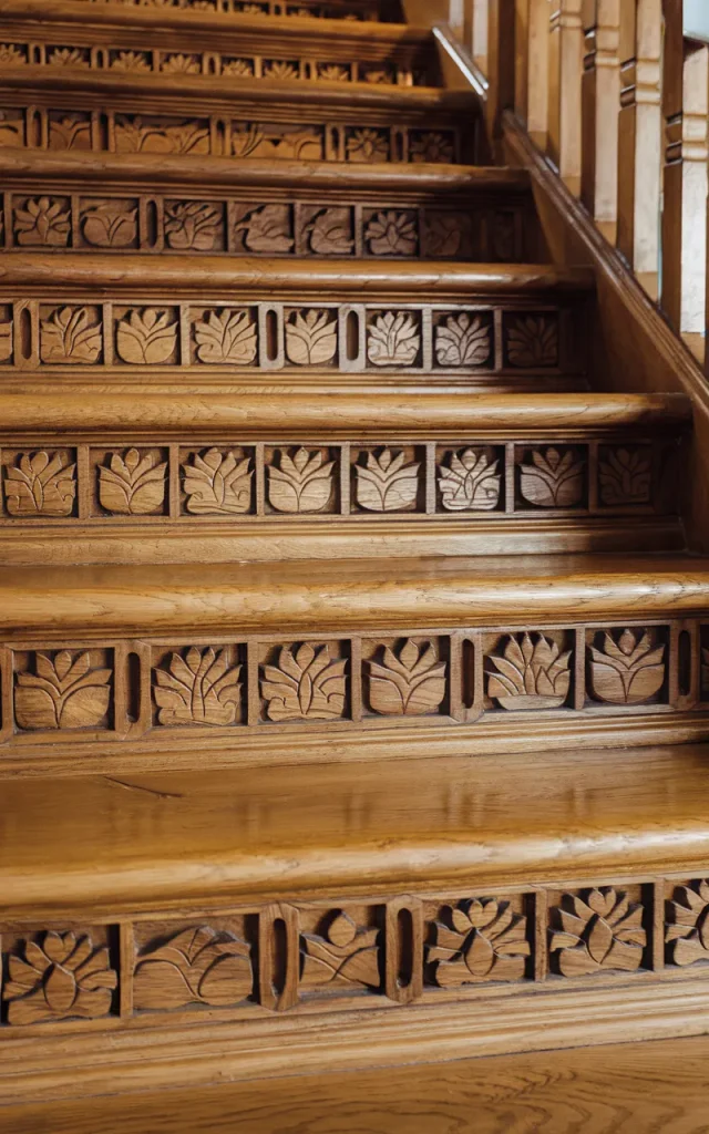 Create wooden riser carvings with symbolic patterns